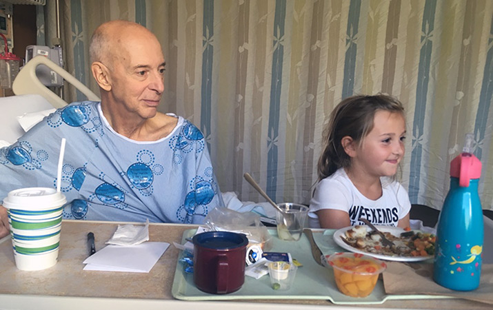 Bill and his granddaughter spend time together before his LVAD implant. “When they first told me about the LVAD I was scared,” says Bill. “But within a day I had come to grips, knowing this is what I need and that I had to go for it.” (Photo: Courtesy Bill George)