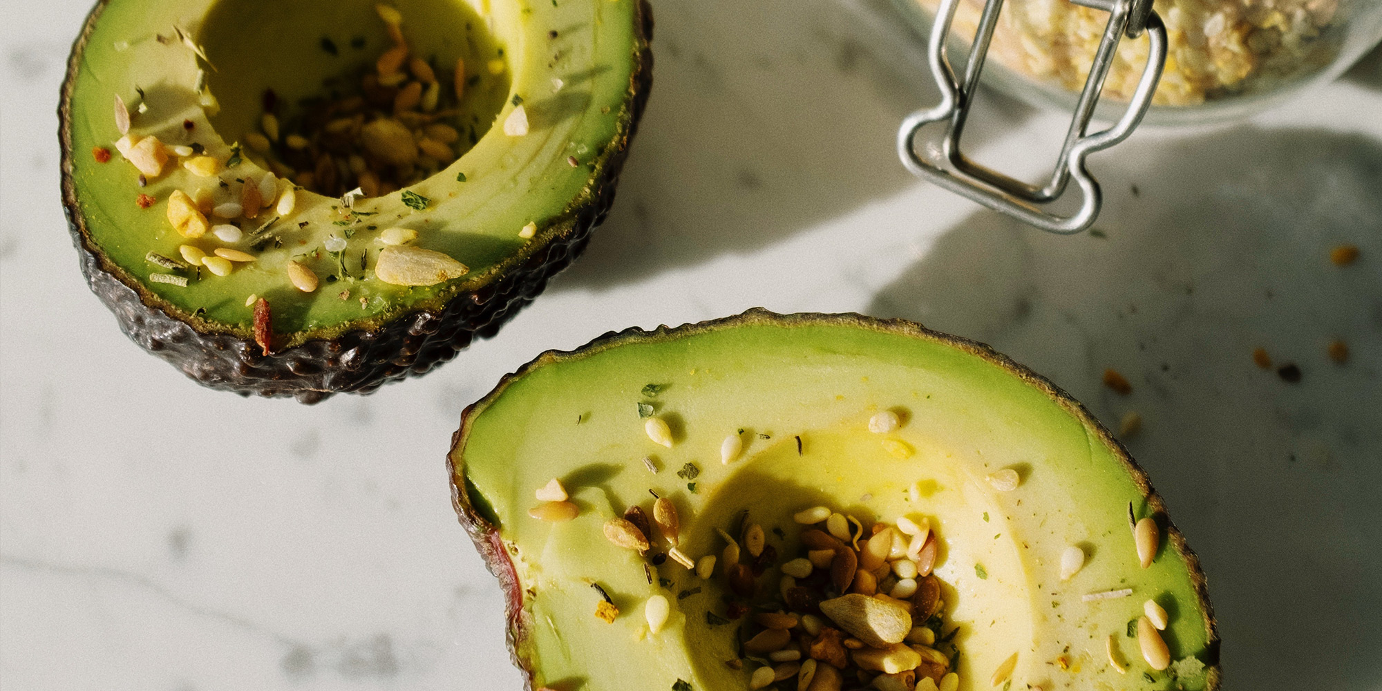 photo: avocados topped with seeds